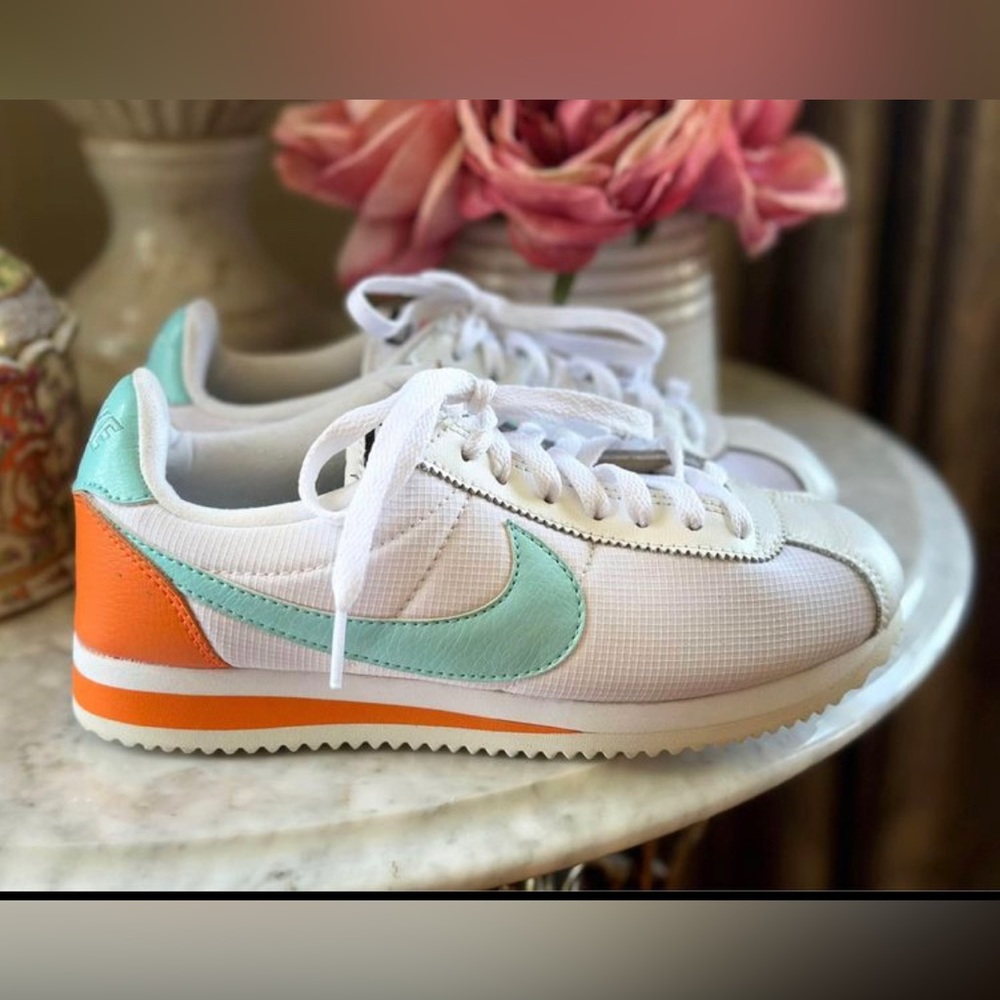 Nike Women’s White Sneakers with Mint Swoosh and Orange Heel Accent